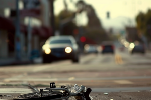 a smashed up bike after being hit by a car